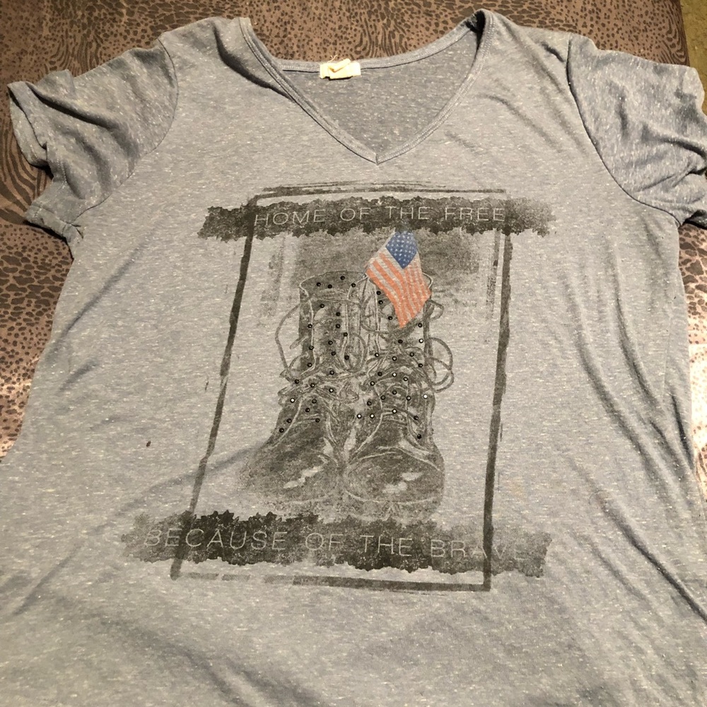 Womens T shirt 87% polyester 13% linen says home of free because of the brave